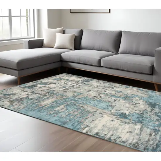 Ivory And Teal Abstract Area Rug Photo 1