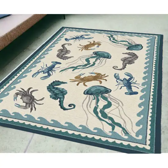 5' X 7' Ivory Or Teal Sea Creatures Indoor Outdoor Area Rug Photo 1