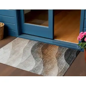 Photo of Khaki Black And Terra Cotta Abstract Washable Indoor Outdoor Area Rug