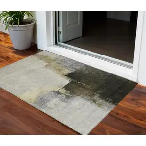 Photo of Khaki Light Green And Black Abstract Washable Indoor Outdoor Area Rug