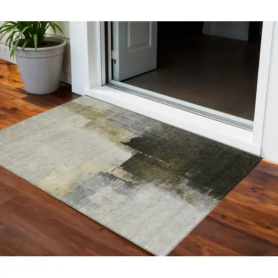 Khaki Light Green And Black Abstract Washable Indoor Outdoor Area Rug Photo 1