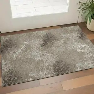 Photo of Latte Ivory And Gray Geometric Washable Area Rug With UV Protection