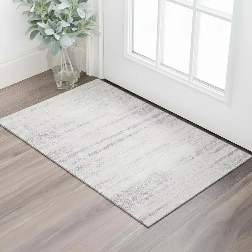 Lavender And Ivory Abstract Washable Area Rug With UV Protection Photo 1