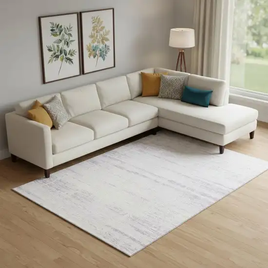 Lavender And Ivory Abstract Washable Area Rug With UV Protection Photo 1