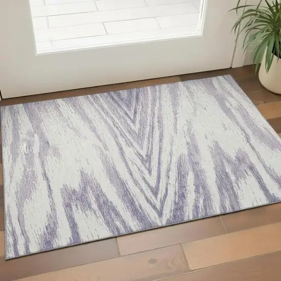 Lavender And Ivory Abstract Washable Area Rug With UV Protection Photo 1