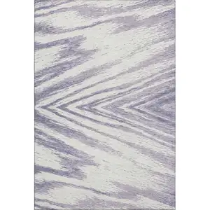 Photo of Lavender And Ivory Abstract Washable Area Rug With UV Protection