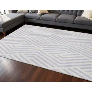 Photo of Lavender And Ivory Geometric Washable Area Rug With UV Protection