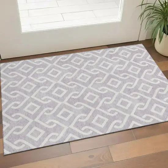 Lavender And Ivory Geometric Washable Area Rug With UV Protection Photo 1