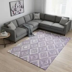 Photo of Lavender And Ivory Geometric Washable Area Rug With UV Protection