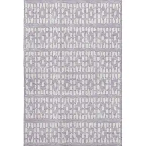 Photo of Lavender And Ivory Geometric Washable Area Rug With UV Protection