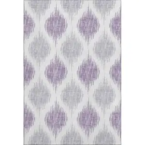 Photo of Lavender And Ivory Ikat Washable Area Rug With UV Protection
