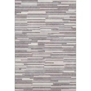 Photo of Lavender And Ivory Striped Washable Area Rug With UV Protection