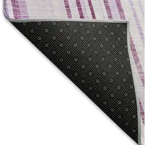 Photo of Lavender And Ivory Striped Washable Area Rug With UV Protection