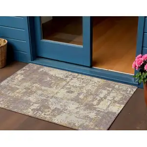 Photo of Lavender Gold And Beige Abstract Washable Indoor Outdoor Area Rug