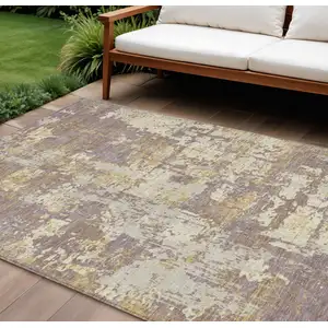 Photo of Lavender Gold And Beige Abstract Washable Indoor Outdoor Area Rug