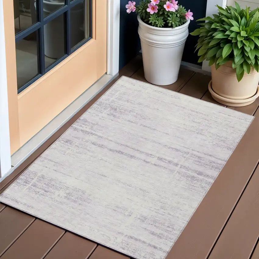 Lavender Purple And Ivory Abstract Washable Indoor Outdoor Area Rug Photo 1