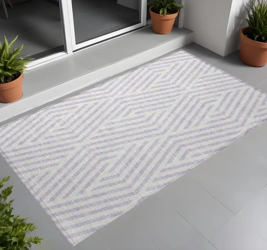 Lavender and Ivory Geometric Washable Non Skid Indoor Outdoor Area Rug Photo 1
