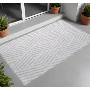 Photo of Lavender and Ivory Geometric Washable Non Skid Indoor Outdoor Area Rug