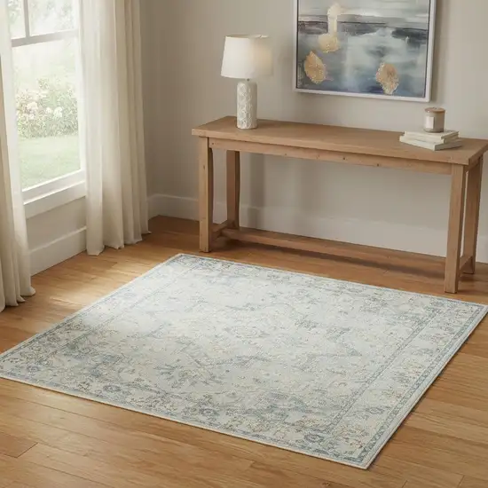 Light Blue Ivory And Yellow Floral Medallion Washable Area Rug Photo 1