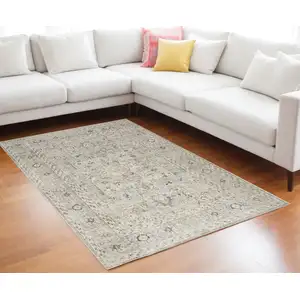 Photo of Light Gray Black And Yellow Floral Distressed Area Rug