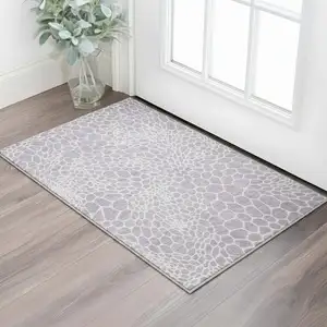 Photo of Lilac And Ivory Geometric Washable Area Rug With UV Protection