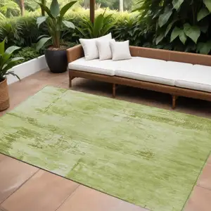 Photo of Lime Green And Ivory Abstract Washable Indoor Outdoor Area Rug