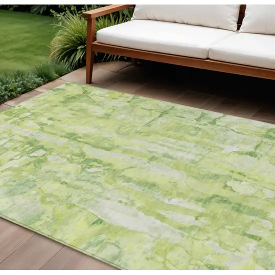 Lime Green And Ivory Abstract Washable Indoor Outdoor Area Rug Photo 1