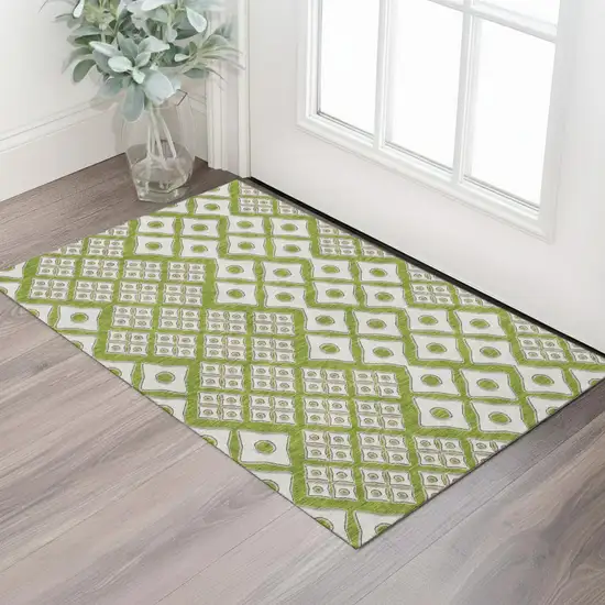 Lime Green And Ivory Geometric Washable Area Rug With UV Protection Photo 1