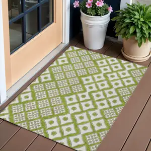 Photo of Lime Green And Ivory Geometric Washable Indoor Outdoor Area Rug