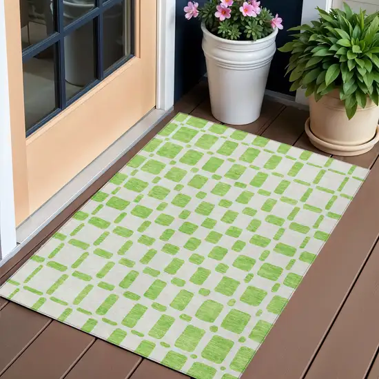 Lime Green And Ivory Geometric Washable Indoor Outdoor Area Rug Photo 1