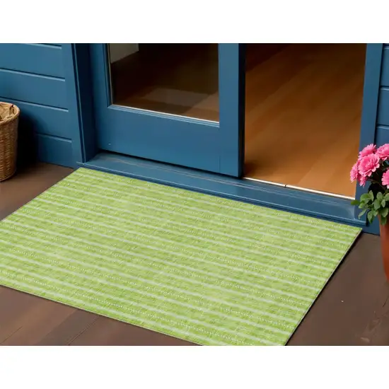 Lime Green And Ivory Striped Washable Indoor Outdoor Area Rug Photo 1