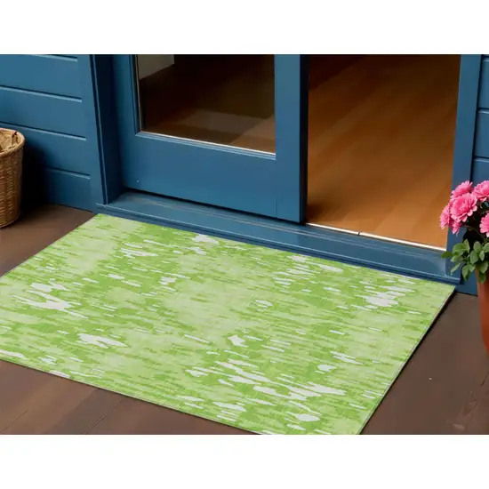 Lime Green And Ivory Striped Washable Indoor Outdoor Area Rug Photo 1