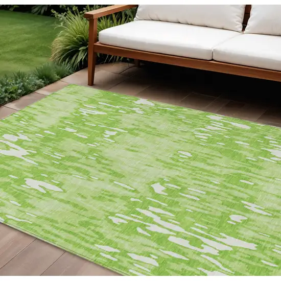 Lime Green And Ivory Striped Washable Indoor Outdoor Area Rug Photo 1
