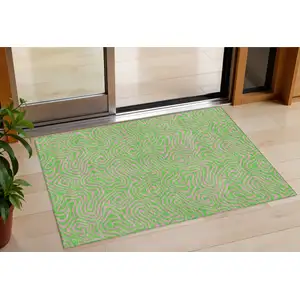 Photo of Lime Green And Pink Abstract Washable Indoor Outdoor Area Rug