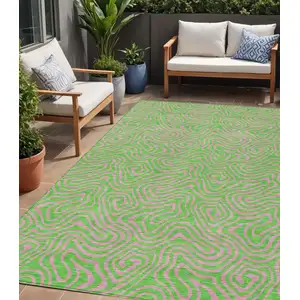 Photo of Lime Green And Pink Abstract Washable Indoor Outdoor Area Rug