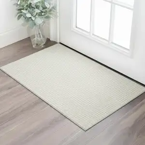 Photo of Linen And Ivory Houndstooth Washable Area Rug With UV Protection