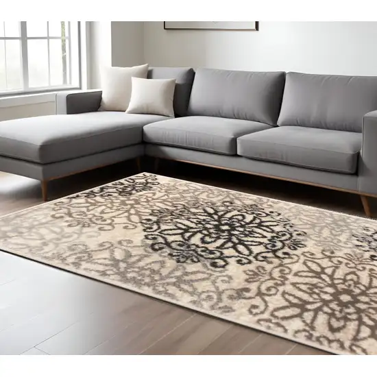 Beige Black And Brown Floral Medallion Area Rug Photo 1