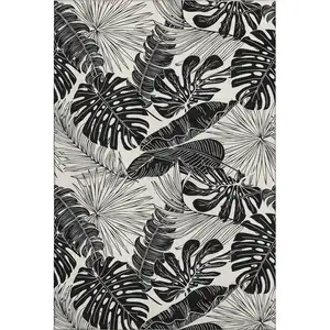 Photo of Midnight And Ivory Geometric Washable Area Rug With UV Protection