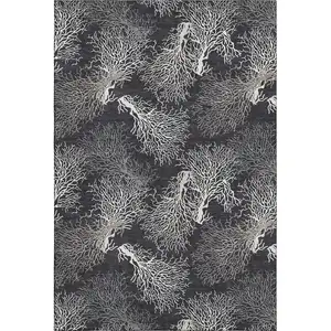 Photo of Midnight And White Geometric Washable Area Rug With UV Protection