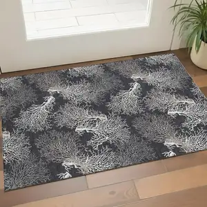 Photo of Midnight And White Geometric Washable Area Rug With UV Protection