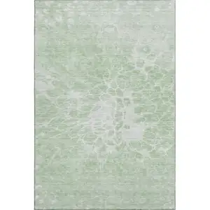 Photo of Mint Green And Ivory Abstract Washable Area Rug With UV Protection