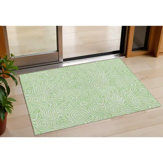 Mint Green And Ivory Abstract Washable Indoor Outdoor Area Rug Photo 1