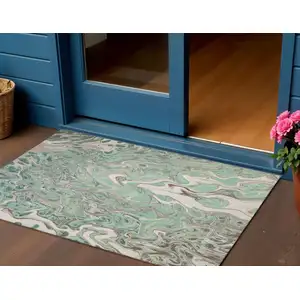 Photo of Mint Green And Ivory Abstract Washable Indoor Outdoor Area Rug