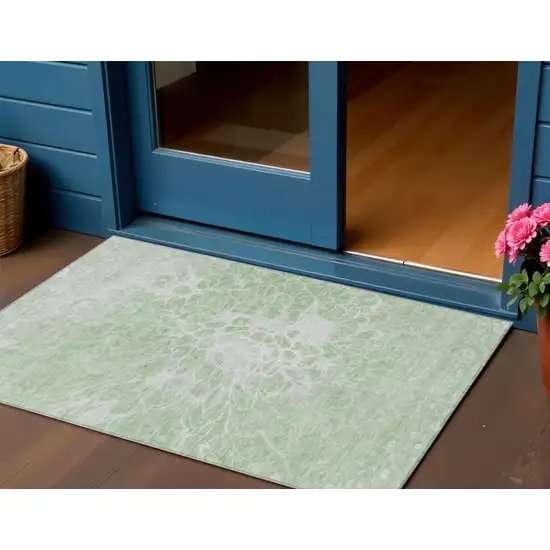 Mint Green And Ivory Abstract Washable Indoor Outdoor Area Rug Photo 1