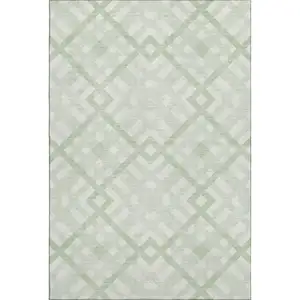 Photo of Mint Green And Ivory Geometric Washable Area Rug With UV Protection