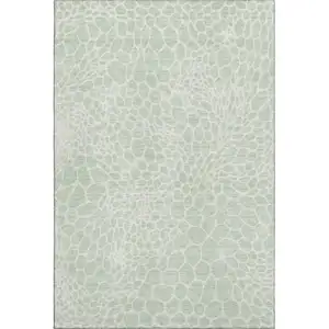 Photo of Mint Green And Ivory Geometric Washable Area Rug With UV Protection