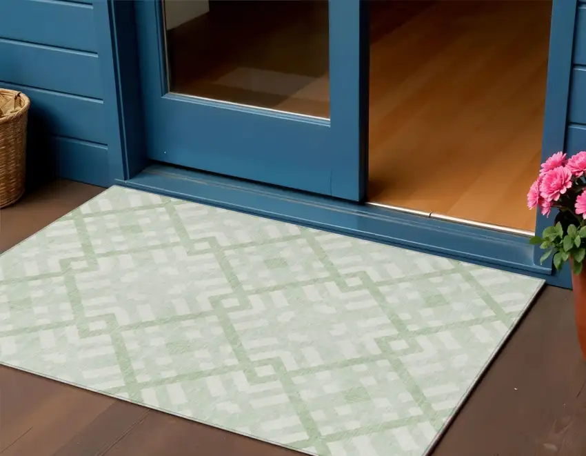 Mint Green And Ivory Geometric Washable Indoor Outdoor Area Rug Photo 1