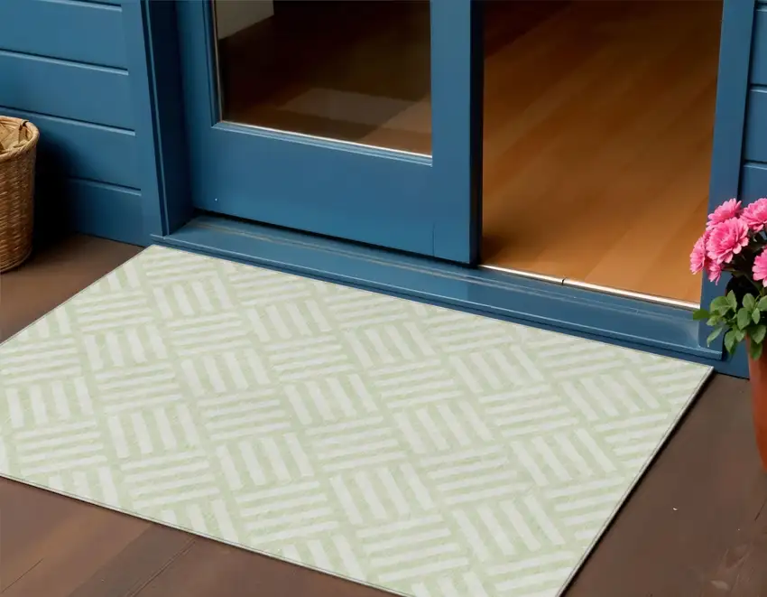 Mint Green And Ivory Geometric Washable Indoor Outdoor Area Rug Photo 1