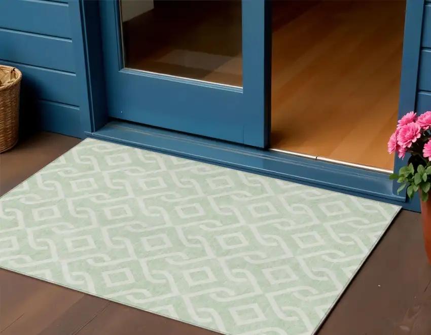 Mint Green And Ivory Geometric Washable Indoor Outdoor Area Rug Photo 1