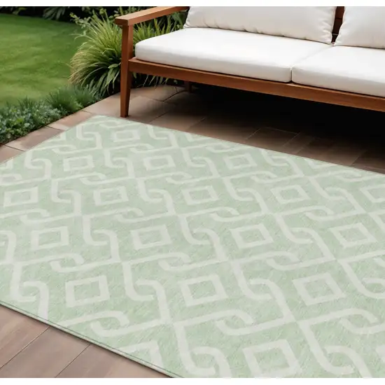 Mint Green And Ivory Geometric Washable Indoor Outdoor Area Rug Photo 1